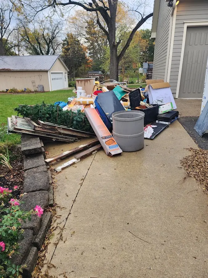 Dumpster being loaded with debris for 3 Yard Dumpster Rental in Mount Washington